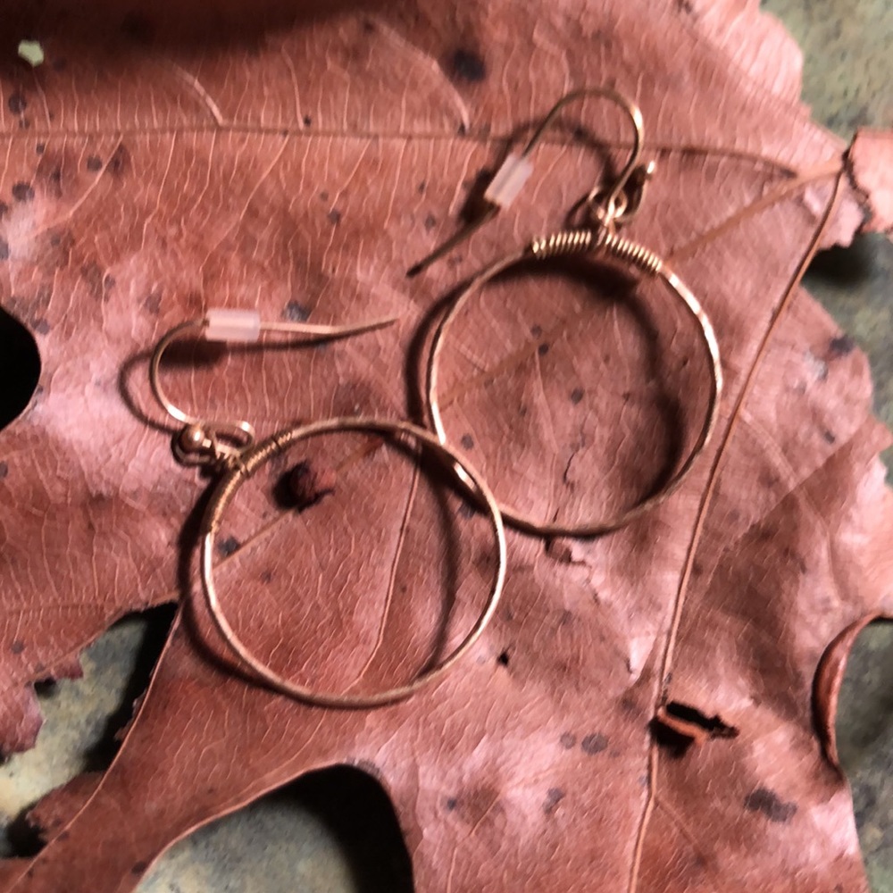 Two pairs of gold tone pierced earrings